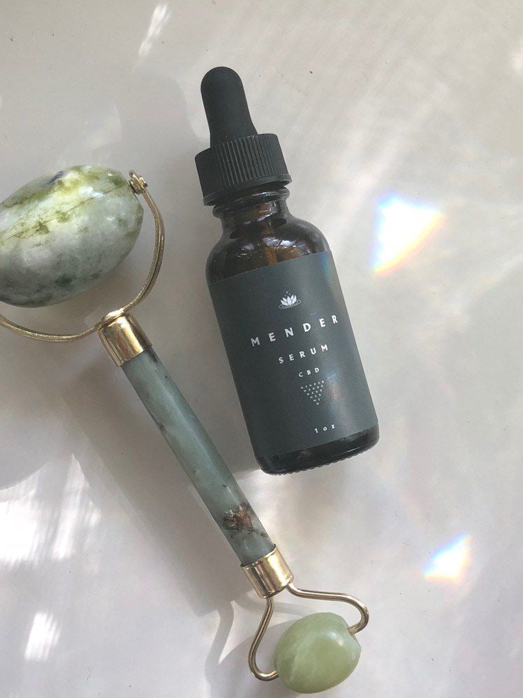 cannabis based face lotion laying on a table